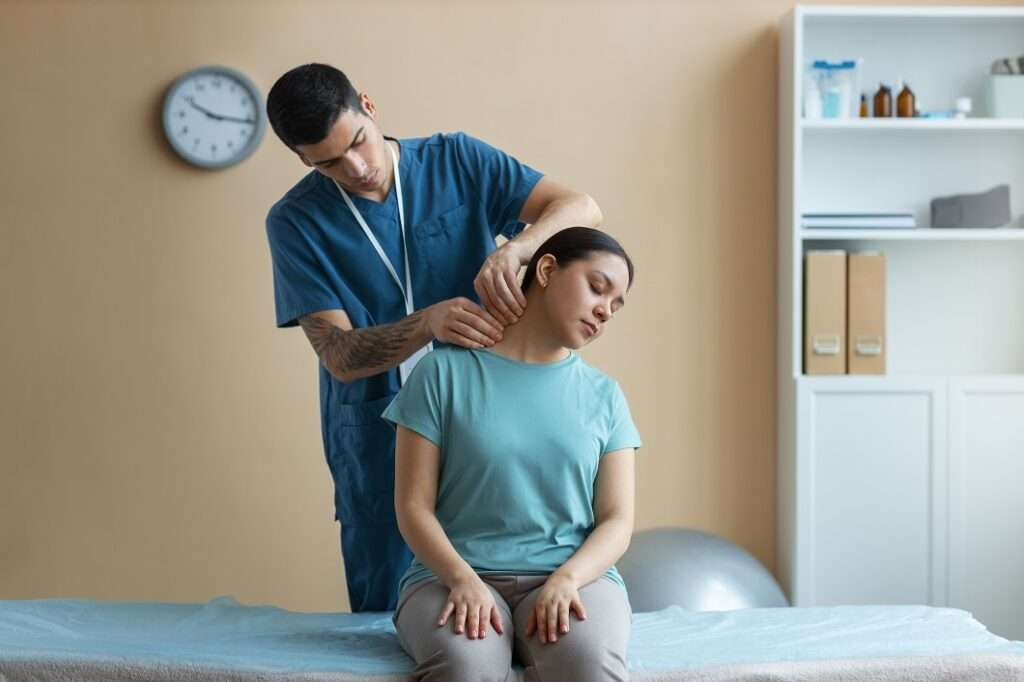 Doctor Helping Patient Rehabilitation